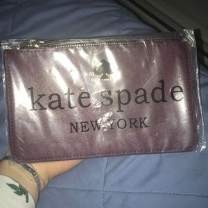 New in plastic plum kate spade wristlet